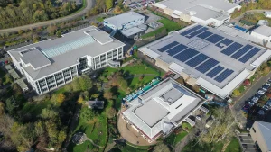 Commercial rooftop solar engineering 2025, Ballasted vs penetrated mounting systems, Warehouse solar panel installation, Commercial solar installation challenges, ASCE 7-22 wind load standards